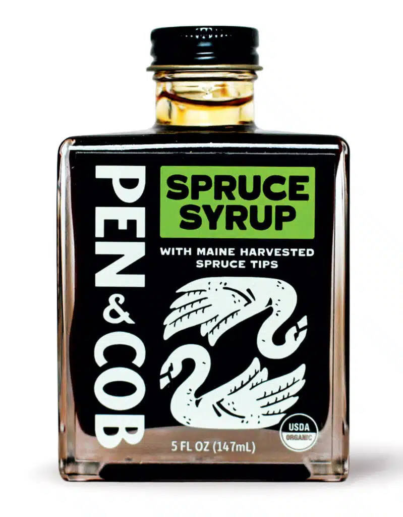 A square bottle of Pen & Cob spruce syrup featuring a label with two illustrated swans.