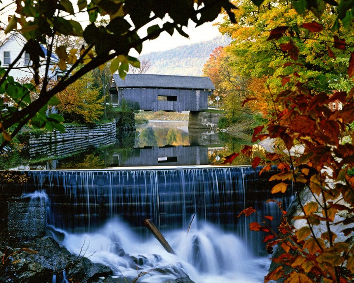 Foliage surrounding the Warren Covered Bridge in Warren, Vermont. 