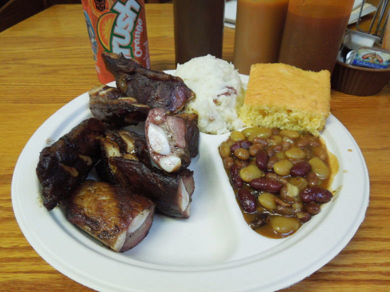 The Becky’s rib tips platter with smashed potatoes, three-bean bake, and a hunk of corn bread. 