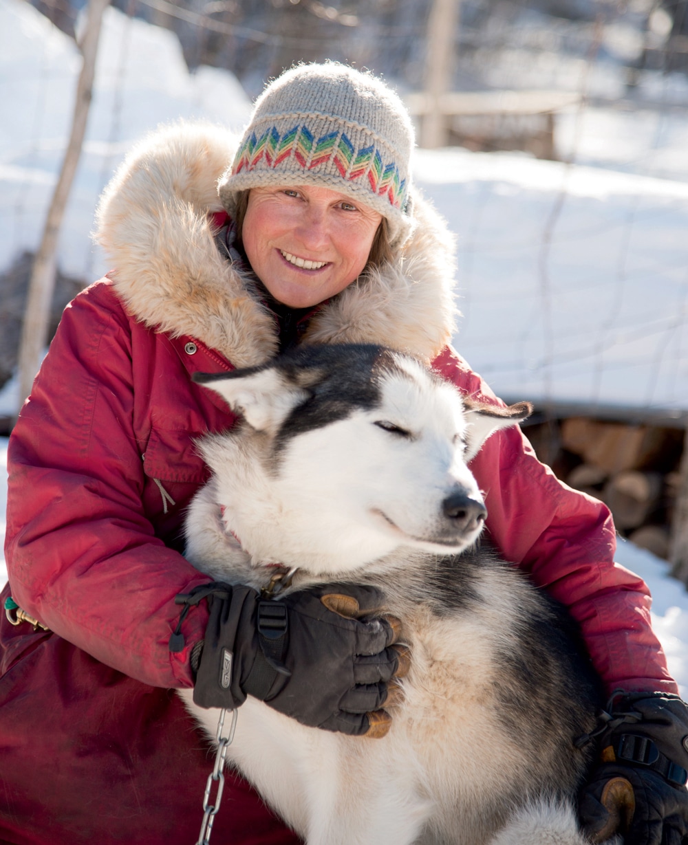 Mahoosuc Guide Service’s Polly Mahoney with one of her Yukon huskies, Myrtle. The pack’s largest female, she was named for Mahoney’s great-aunt.