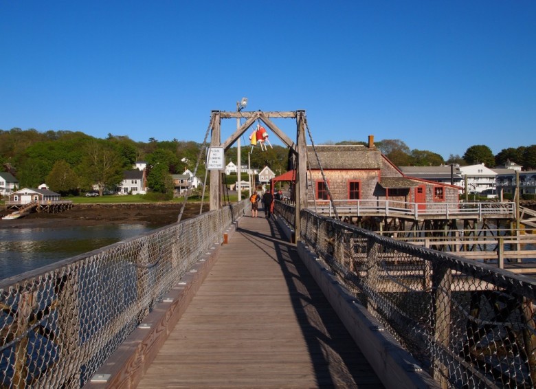 Cross the famous footbridge to get an on-the-water glimpse of the harbor.