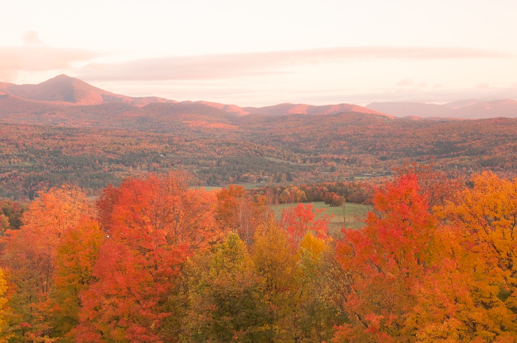 Autumn foliage colors the Green Mountains in Stowe, Vermont.