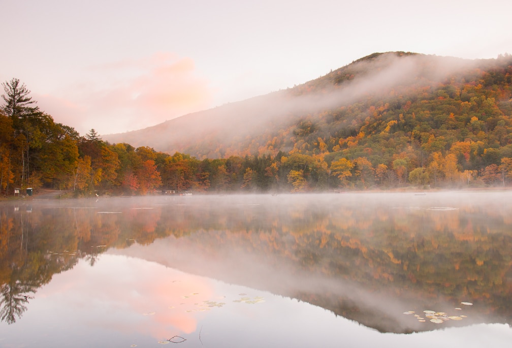 Dawn at Amherst Lake in Plymouth, Vermont.
