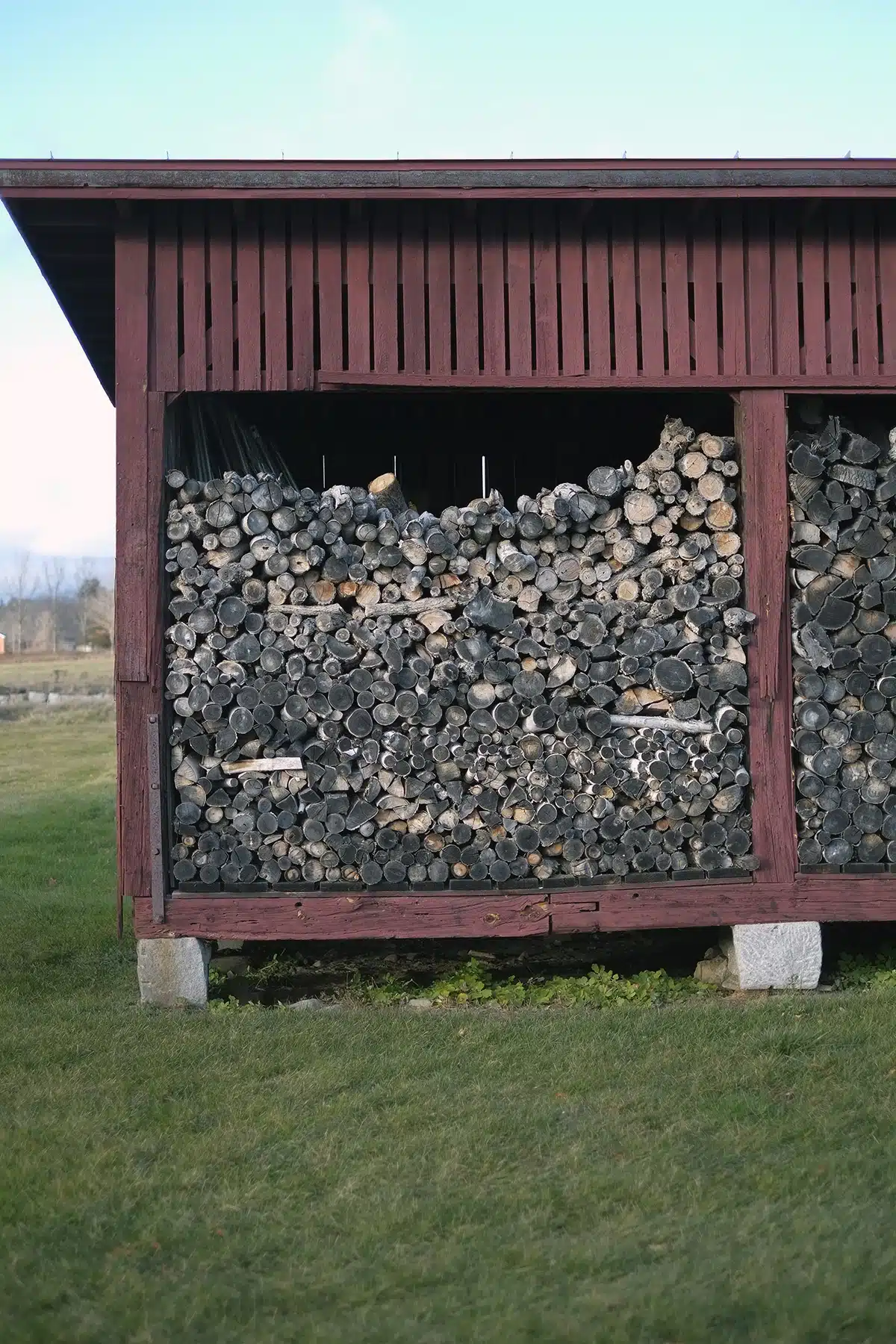 Wood for the village stacked high in the East Woodshed.