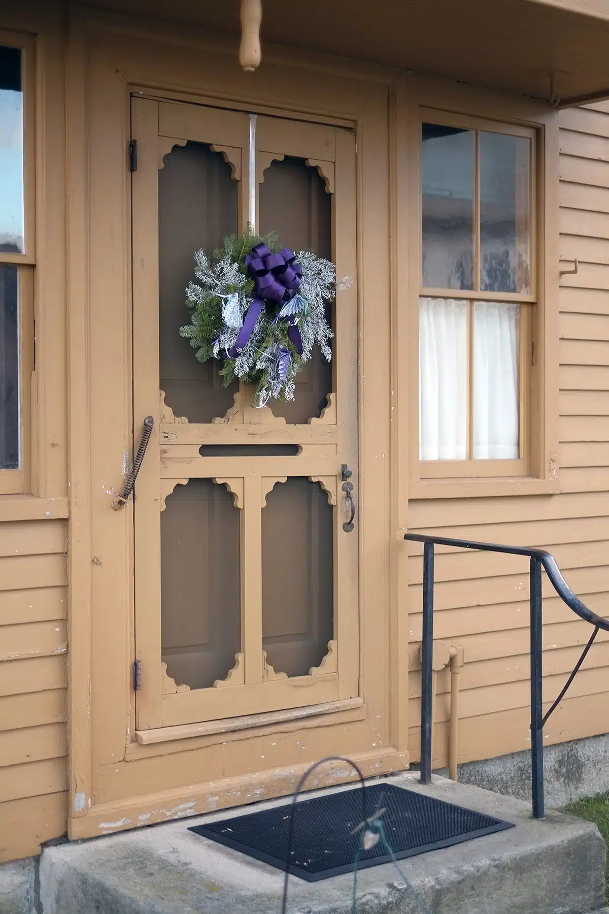 A large purple bow and handmade fan ornaments decorate the entrance to the the Sisters' Shop.