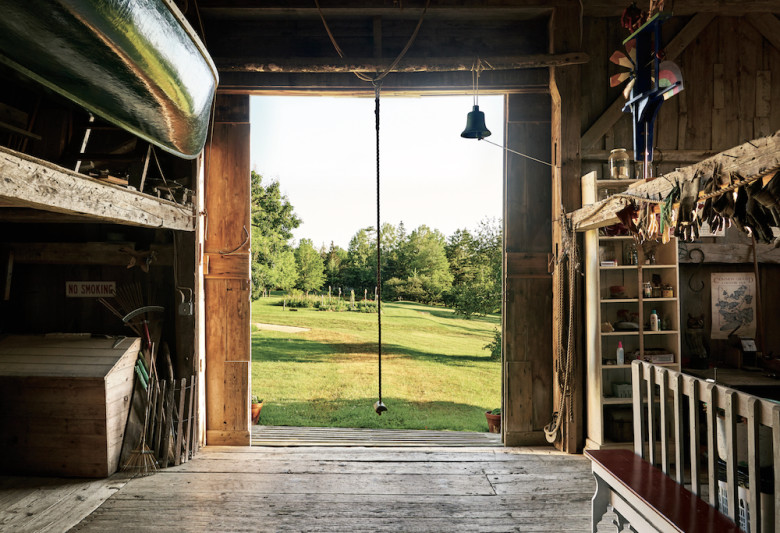 The interior of the barn, looking out to the fields. Hanging in the doorway is the rope swing made famous in E.B. White’s 1952 children’s classic, Charlotte’s Web.