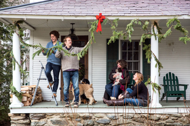 The holiday greenery goes up the first weekend in December—a family effort that includes (l. to r.) son Eli, John Rushing, Ellen Stimson, daughter Hannah, and Oscar (Wheaten Terrier), Violet (Bernese Mountain Dog), and Charlie (Havanese).