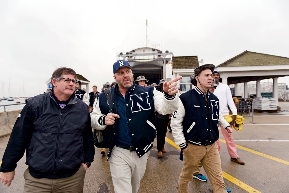 Head coach Brian Ryder, center, leads the way as the Nantucket football contingent walks down to the ferry for the two-and-a-half-hour trip to Martha’s Vineyard.