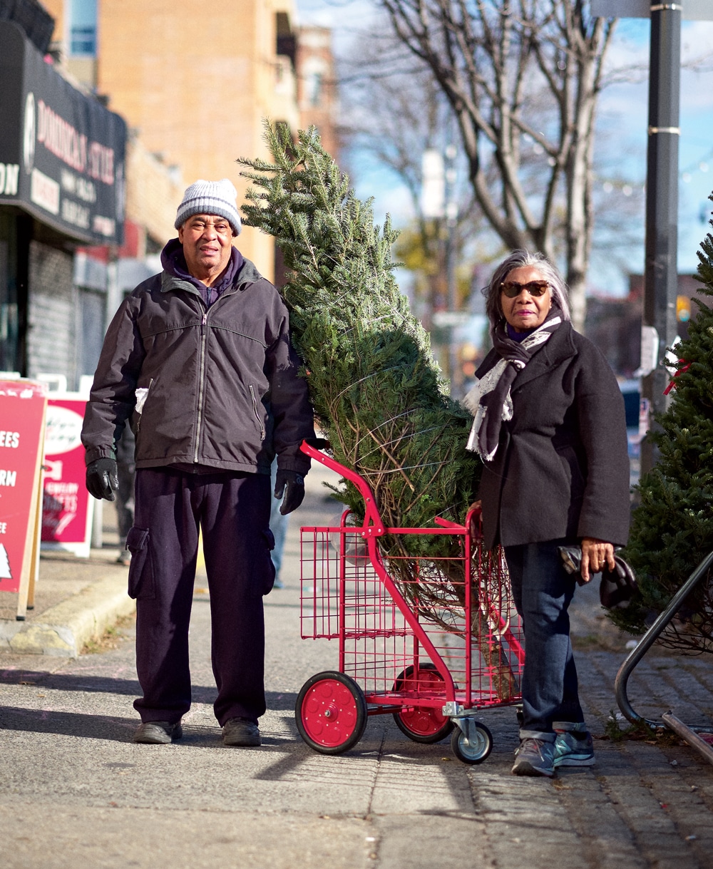 Andre and Lela Madoo, who pride themselves on shopping at independent businesses, show off their tree of choice. This was their third year of buying from the Houles.