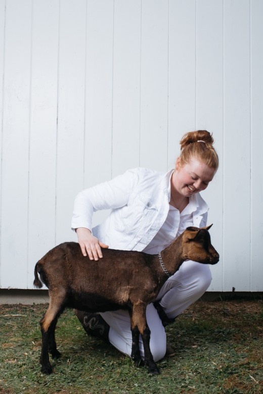 Bailey Cross, 16, of South Berwick, Maine, stands for a portrait with her goat, Flint.