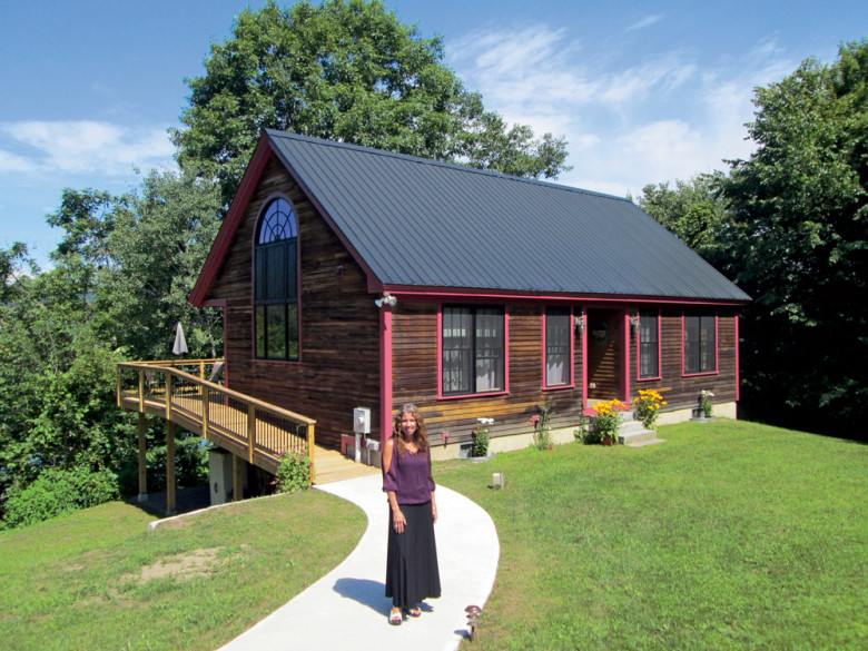 Building her own home allowed Lynne Fenoff to finally afford the riverfront property of her dreams (above). She designed it herself—from the window-filled exterior to the modern, open interior.