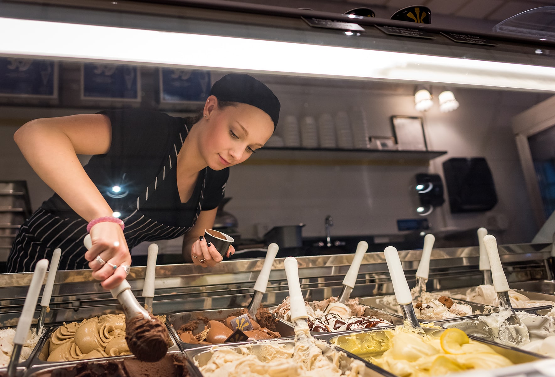 Leah Shipulski of Etna, NH scoops up a serving of chocolate at Morano Gelato.