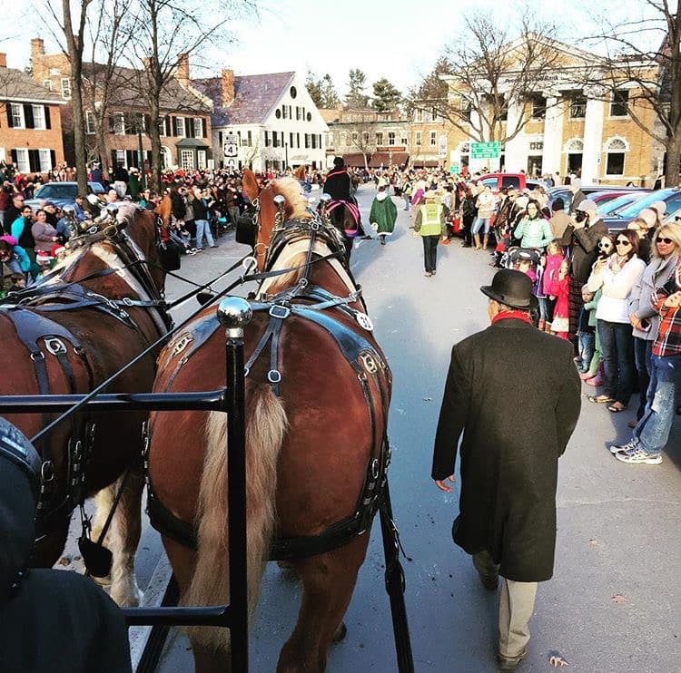 The annual holiday parade in Woodstock, Vermont draws a crowd to the streets. 