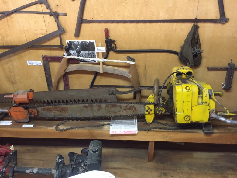 The mechanization of the lumber industry eventually introduced chainsaws into the woods. Big machines, like this two man saw, could easily weigh more than fifty pounds. 