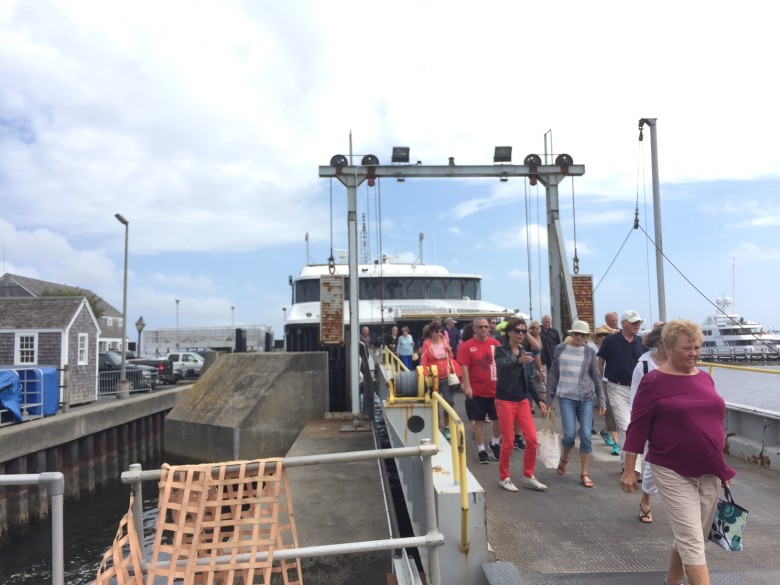 Happy travelers departing the Nantucket ferry for their island visit. 
