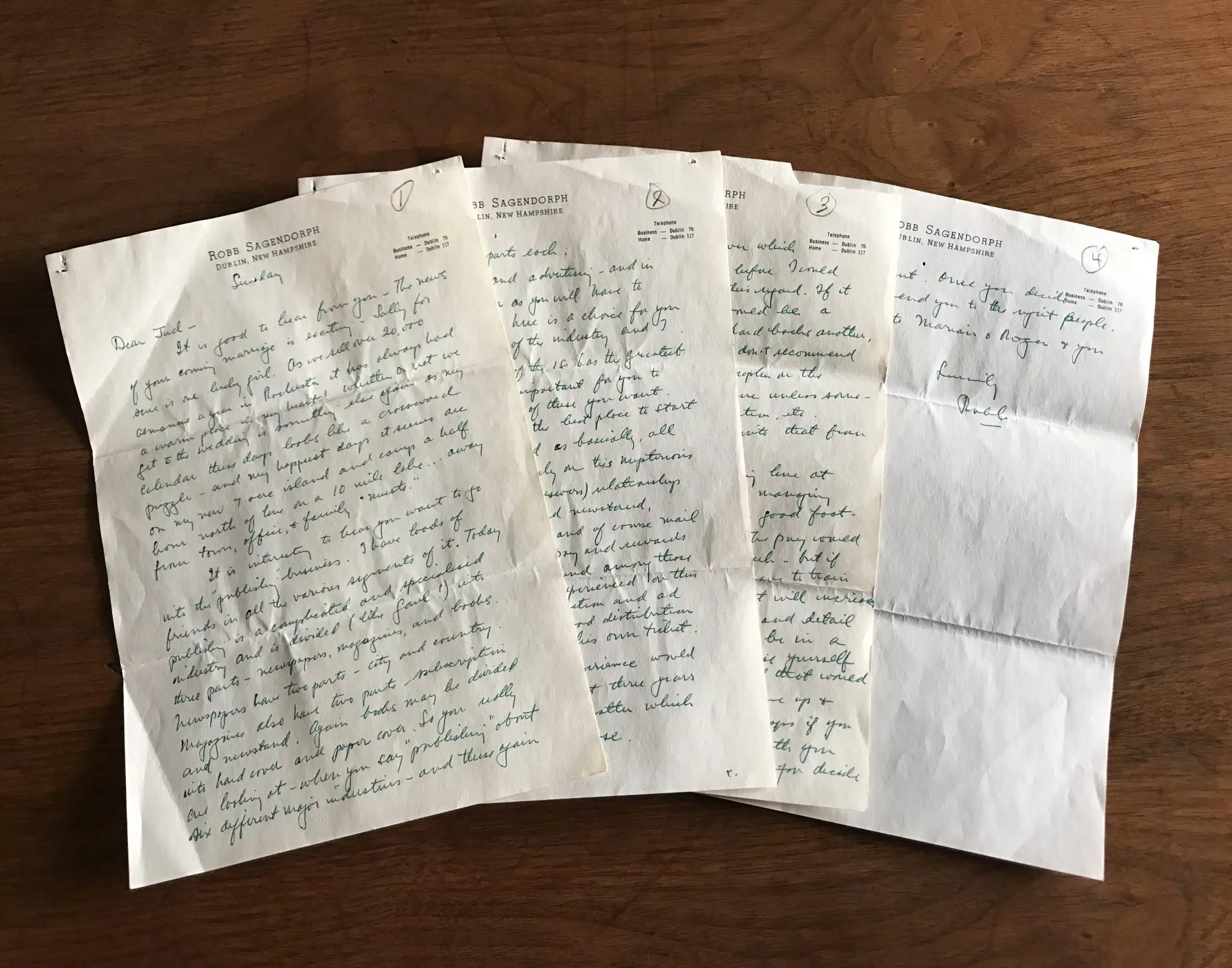 Four handwritten letters on white paper, spread out on a wooden table. The fate of Yankee.
