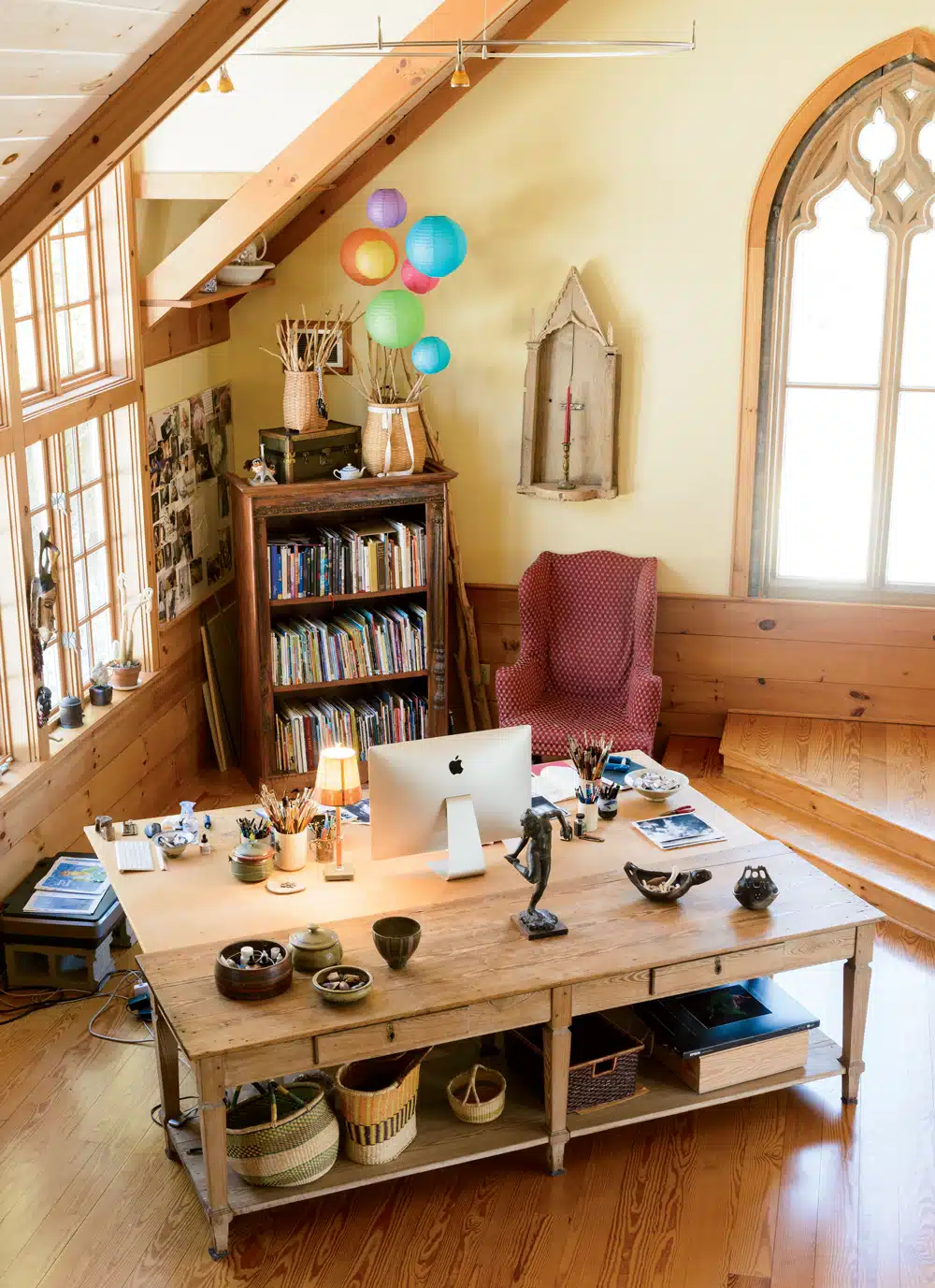 The studio with its glorious Gothic window, discovered at the Old House Parts Co. in Kennebunk. “They’d had it for 40 years and were pretty reluctant to pull it out for us,” Lita says. “It was so big, so heavy!”