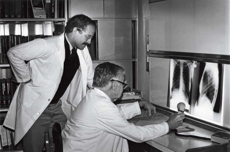 Lepore in his early years on Nantucket (c. mid-1980s), peers at x-rays with the hospital’s radiologist, Dr. Kenneth Seagrave.