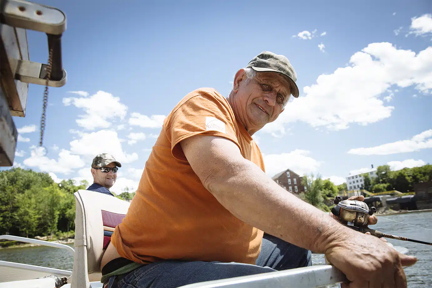 Lemuel Palmer fishes for white perch just below the falls in Vergennes with his friend Bill "Fish Hawk" Dutton.