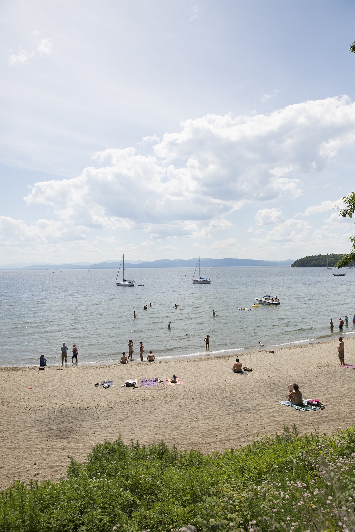 Summer is in full swing at North Beach Park. We passed this scene on the way to Charlie's Boathouse. You get a great view of the beach from the bike path.
