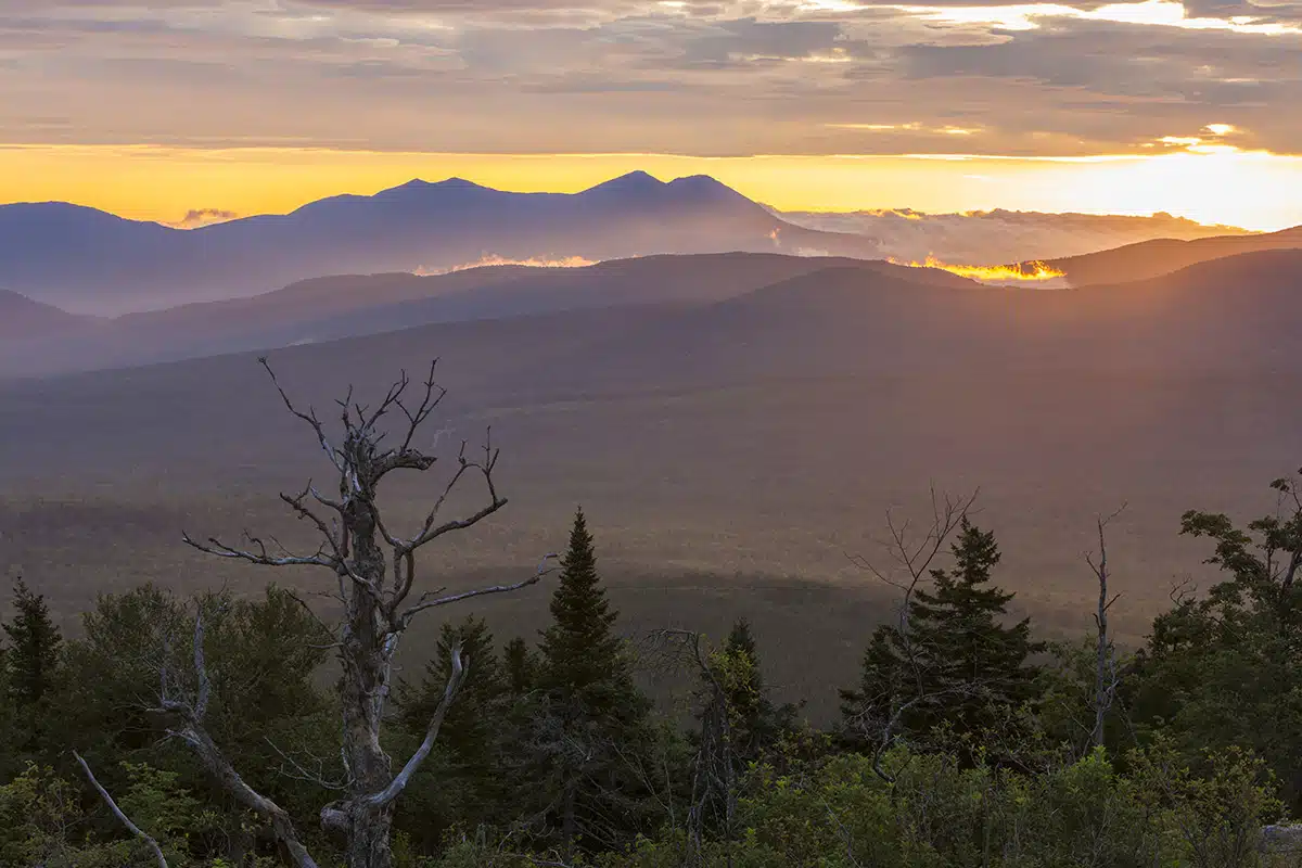 Sunrise view over the Reddington Forest of the Bigelow Range (left) from Quill Hill in Reddington Township, Maine. Appalachian Trail.