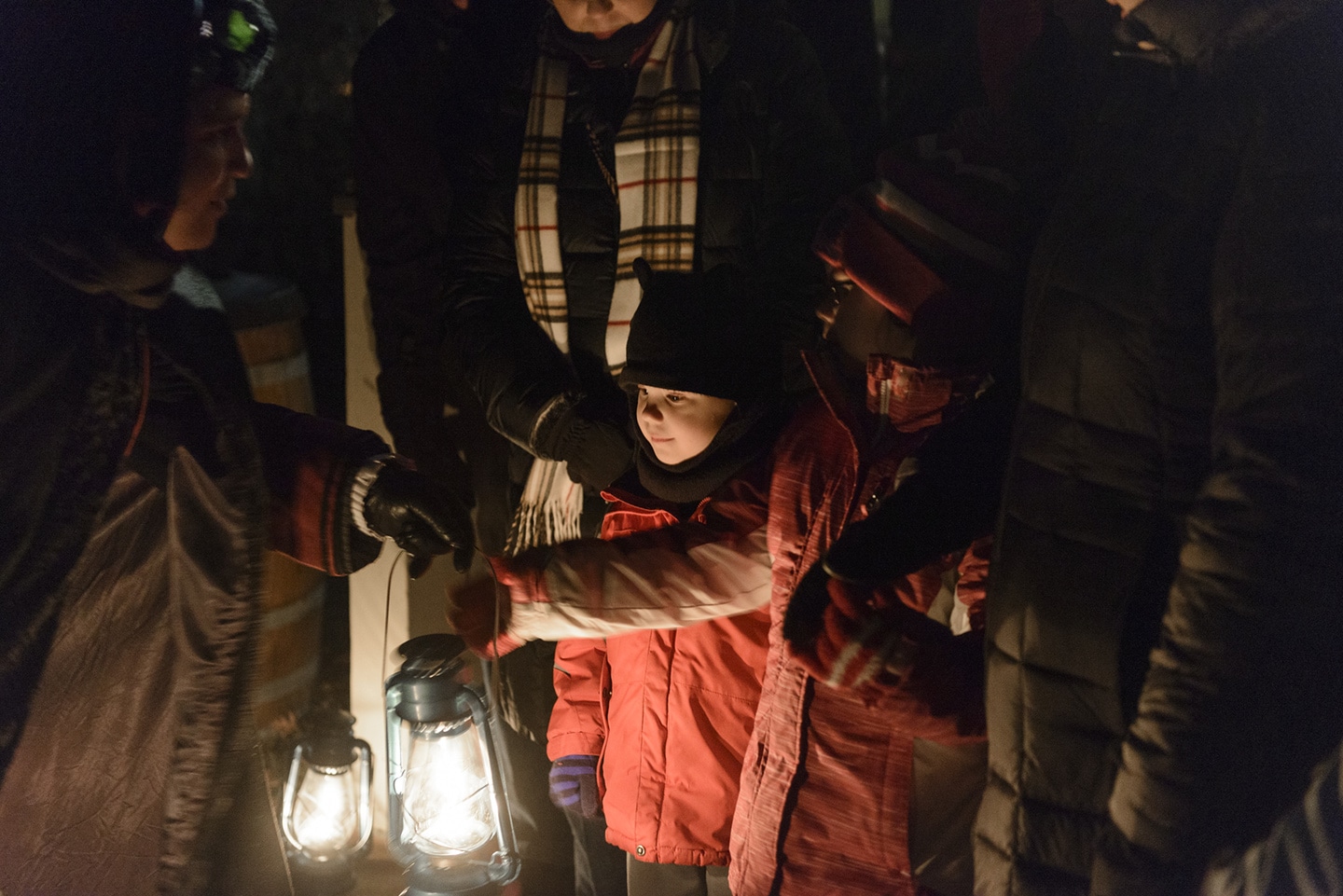 Children receiving their lanterns for the lantern tour of Mystic Seaport.