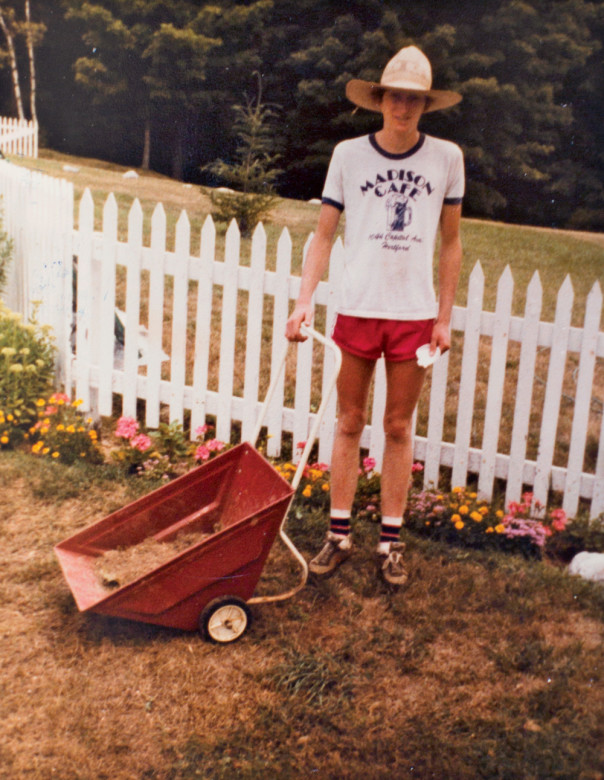 The author, c. 1982, dutifully weeding near the fence for his grandmother.