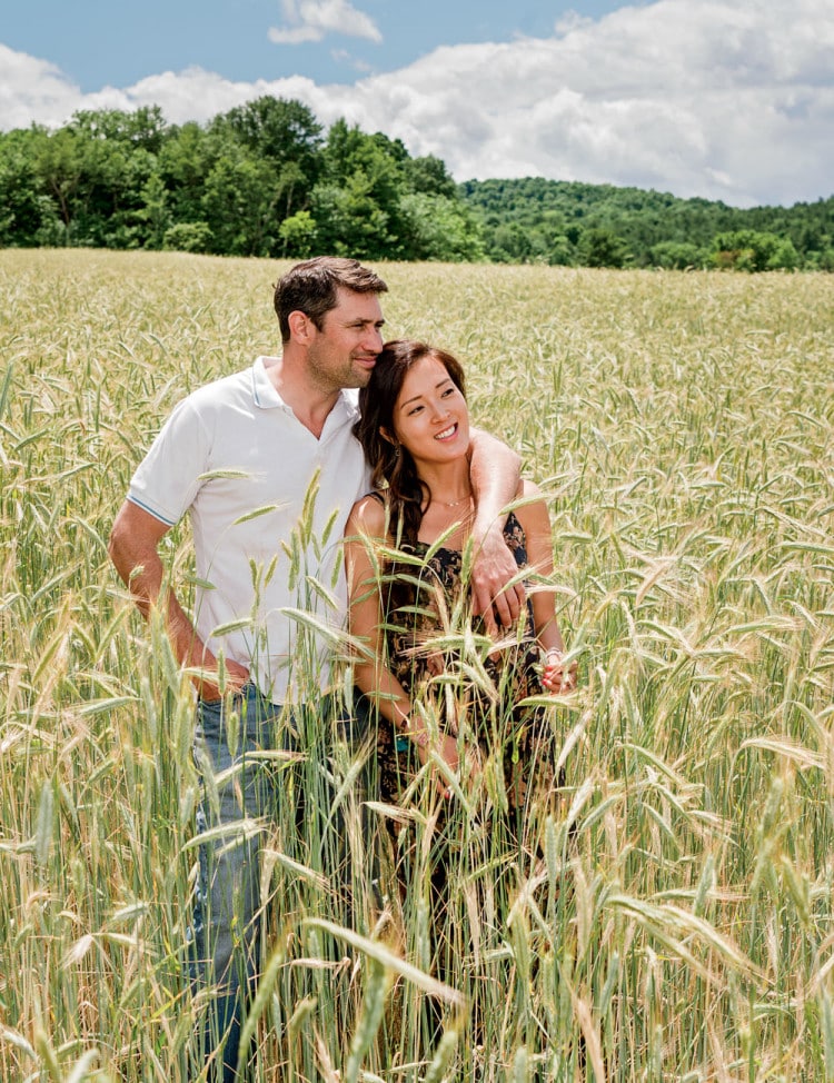 Bhakta with wife Danhee Kim at WhistlePig Farm in Shoreham, Vermont. Much of the 1,200-plus acres that Bhakta owns here is planted with rye, which is destined to be distilled and then aged in barrels made from oak harvested from the property.