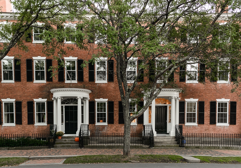 Stately brick architecture and quiet signs of autumn along historic Chestnut Street.