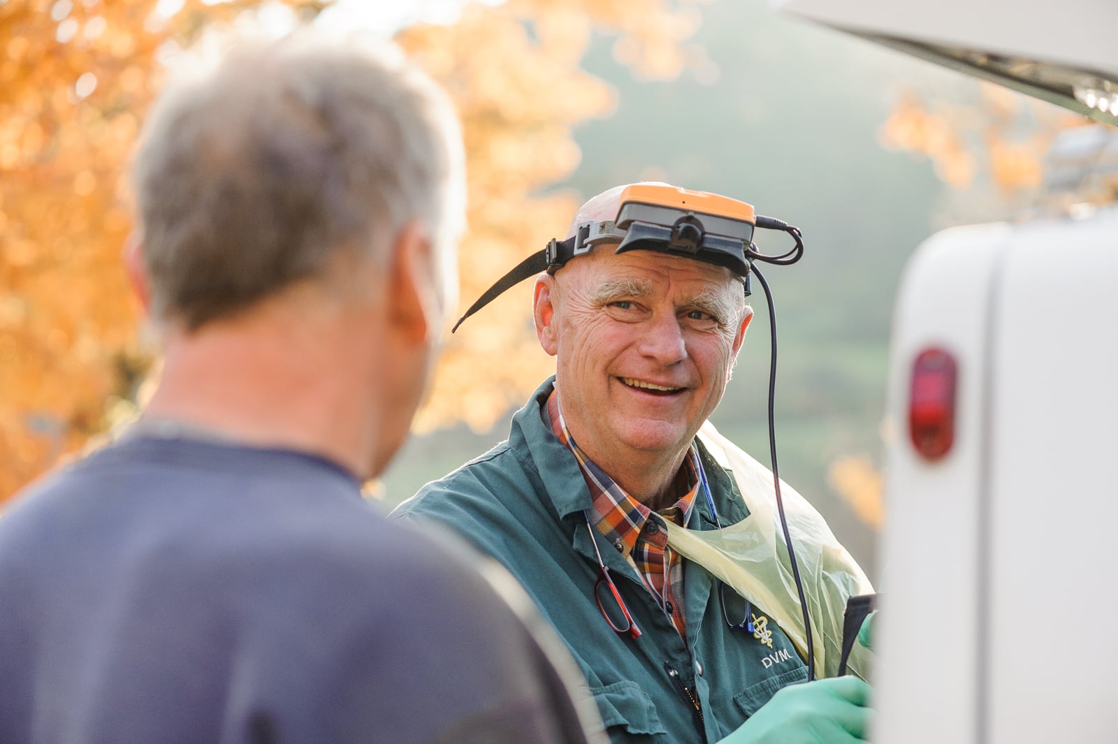 Tom Stuwe shares a laugh with a client at Howvale Farm in Tunbridge, VT.