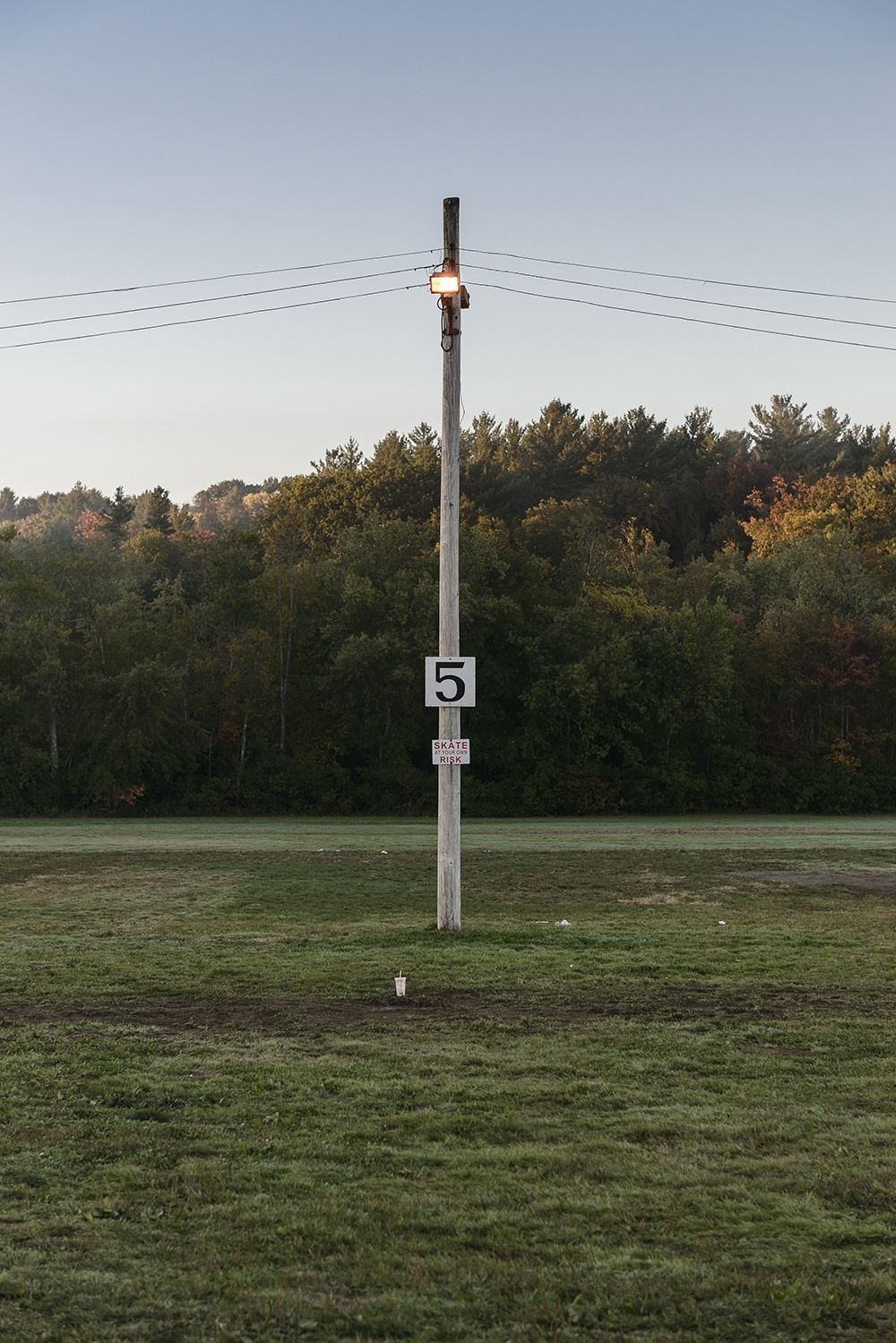 Empty fair parking lot. I love the light on this shot and the symmetry with the pole.