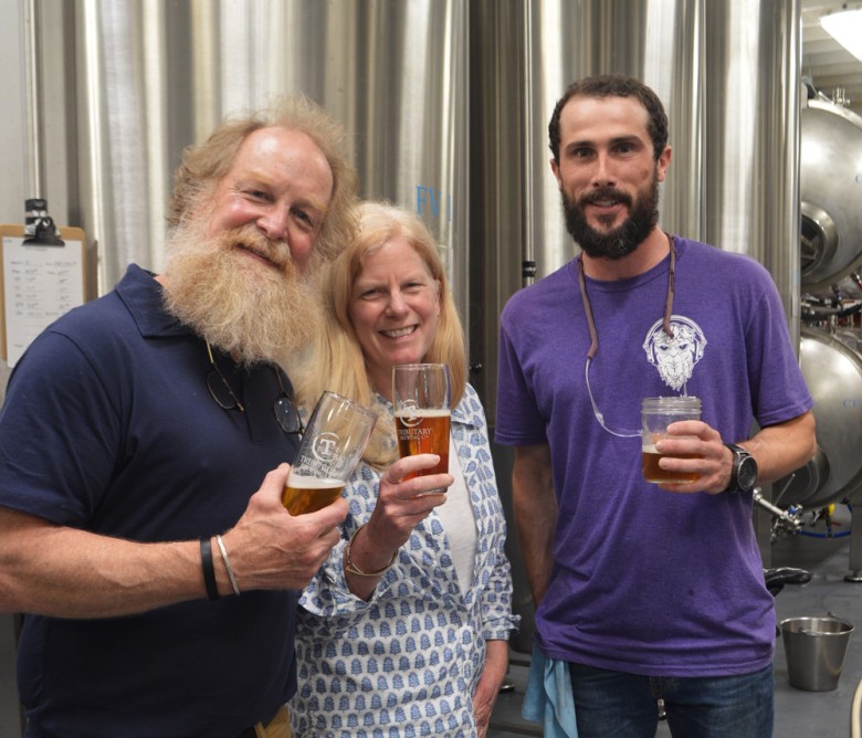 Tributary founders Tod Mott (left) and his wife, Galen, along with brewer Ian Browne.
