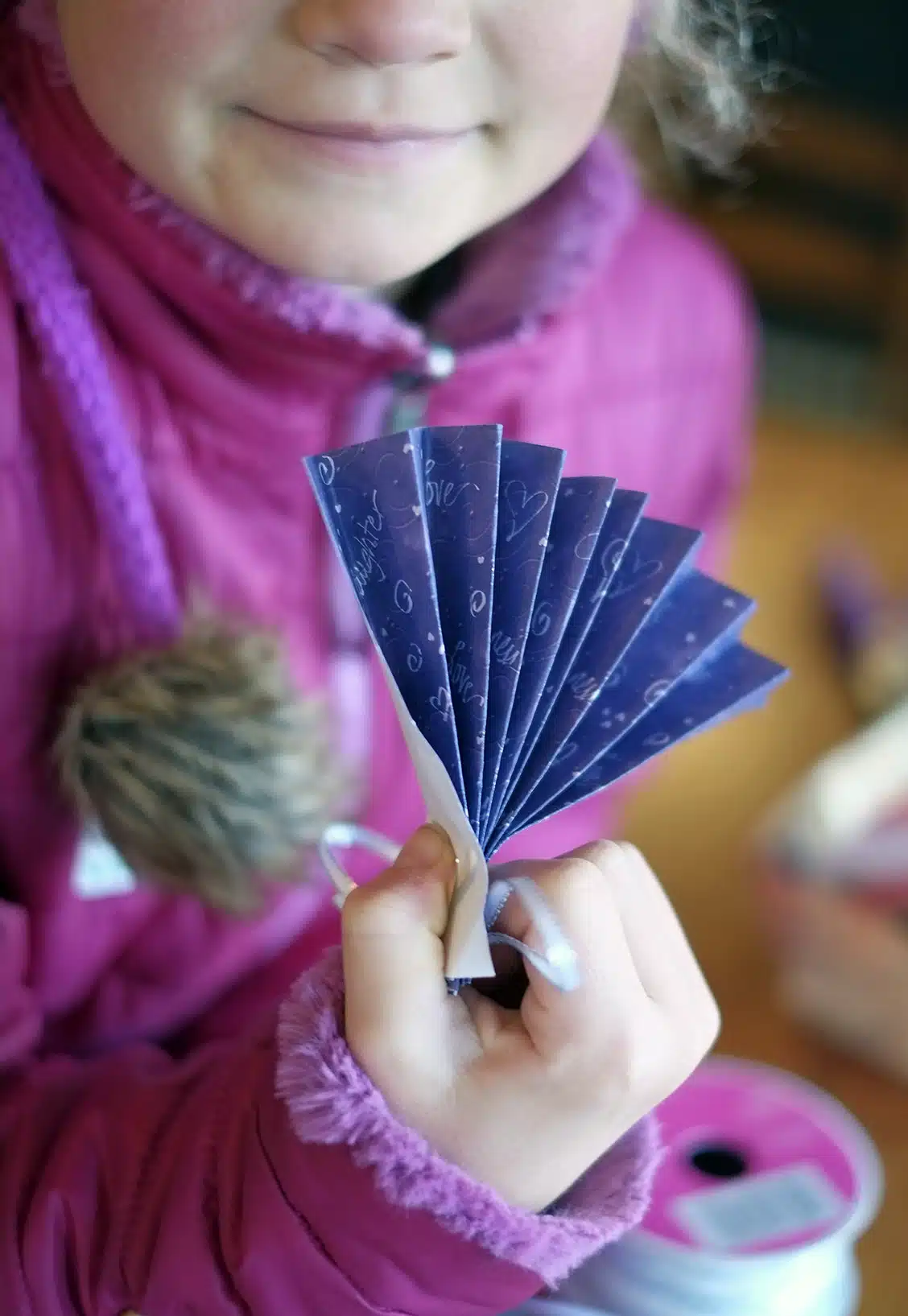 A happy maker with her finished ornament fan.