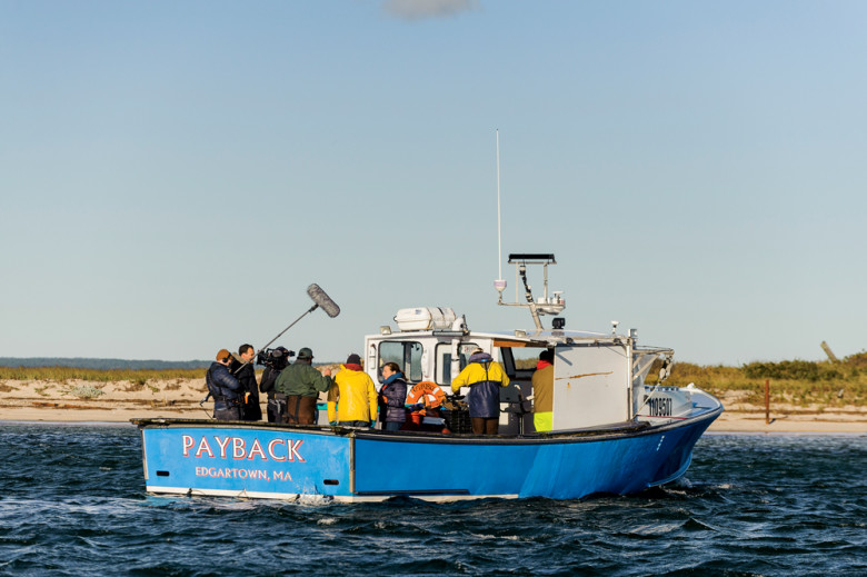 Cast and crew bundle up for a segment on bay scallops.