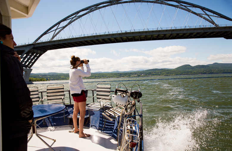 As the houseboat passed beneath Lake Champlain Bridge, which connects Vermont to New York, Elizabeth Yon kept an eye on watercraft sharing the narrow southern part of the lake. 