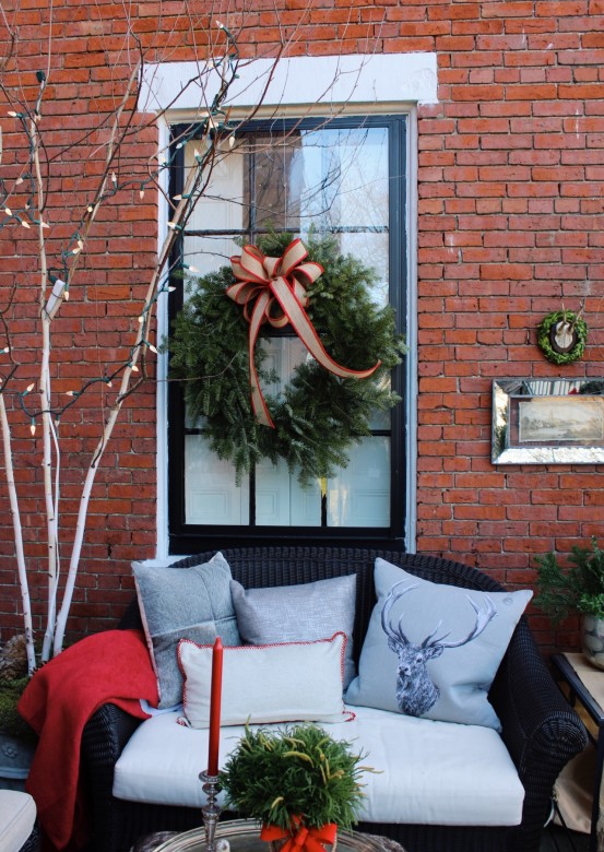 Interior designer Barbra Pervier created a beautiful escape on her porch. She wanted to evoke the feeling of Austria in honor of her family's heritage. 