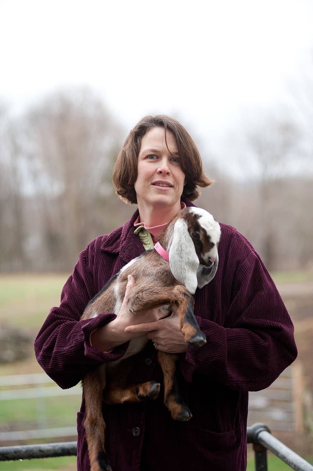 Elizabeth holds a young Anglo-Nubian goat at Valley View Farm in Topsfield, Massachusetts. 