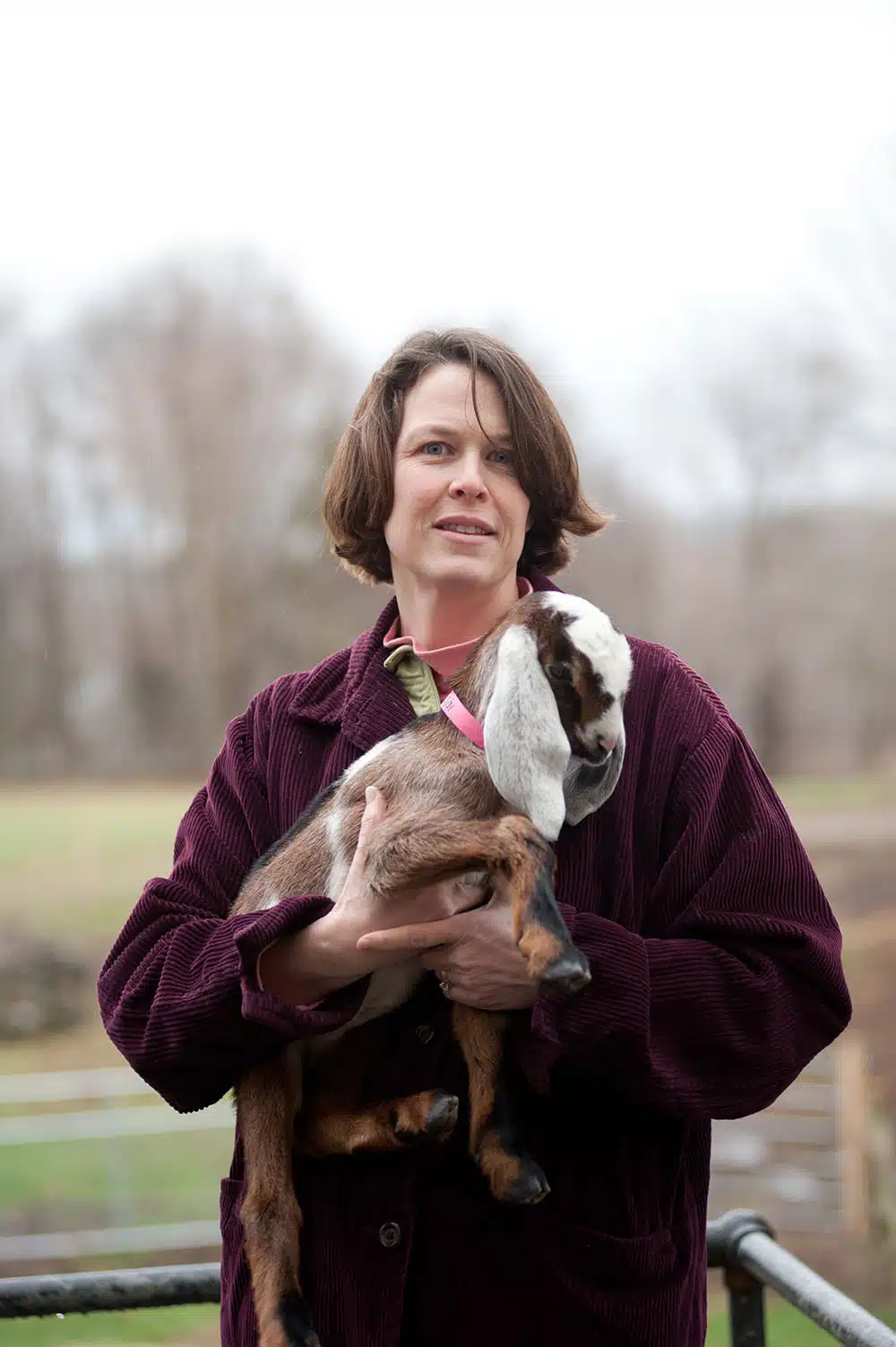 Elizabeth holds a young Anglo-Nubian goat at Valley View Farm in Topsfield, Massachusetts.
