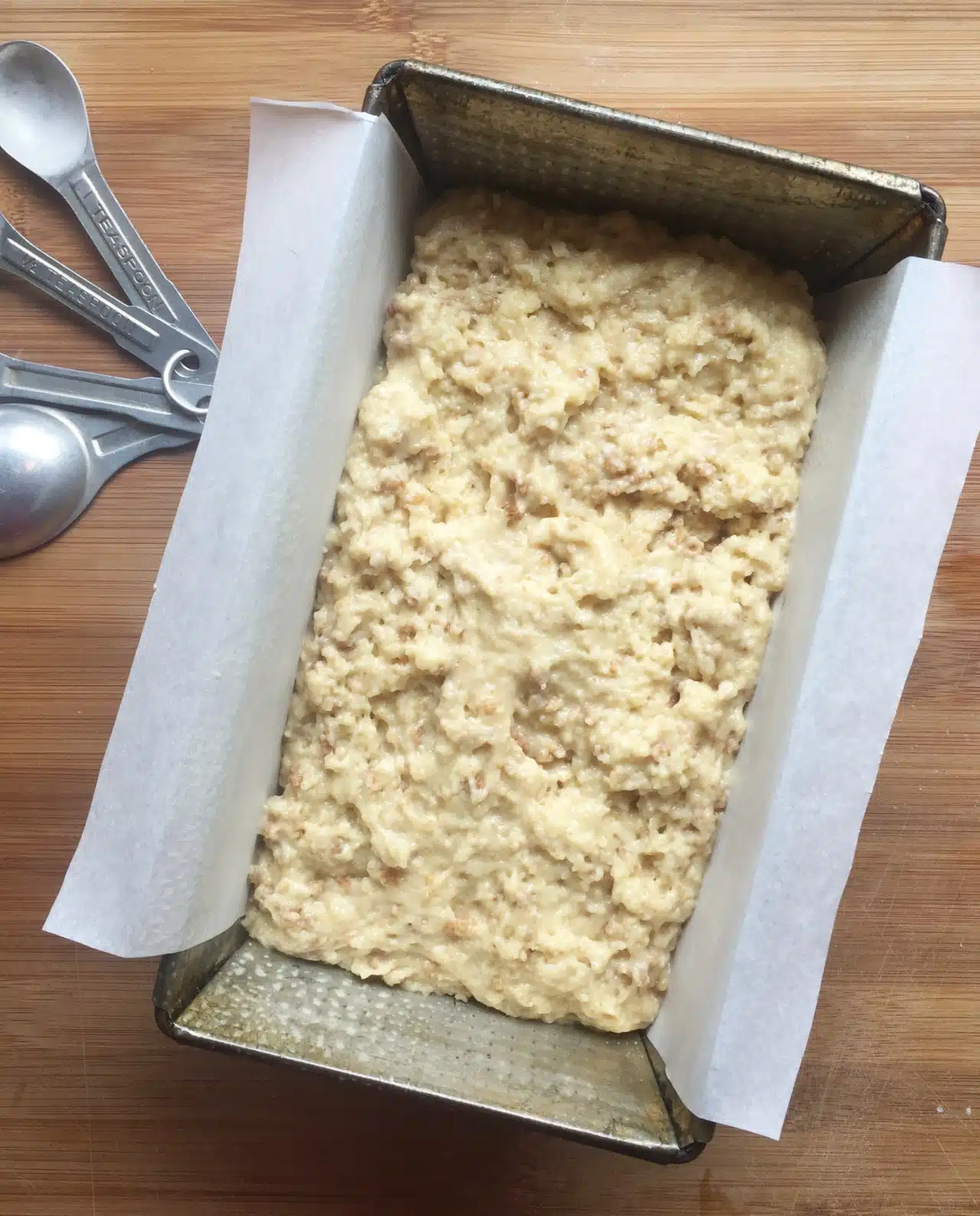 Pour the batter into the waiting parchment-lined loaf pan and bake at 350 degrees for 40-45 minutes.