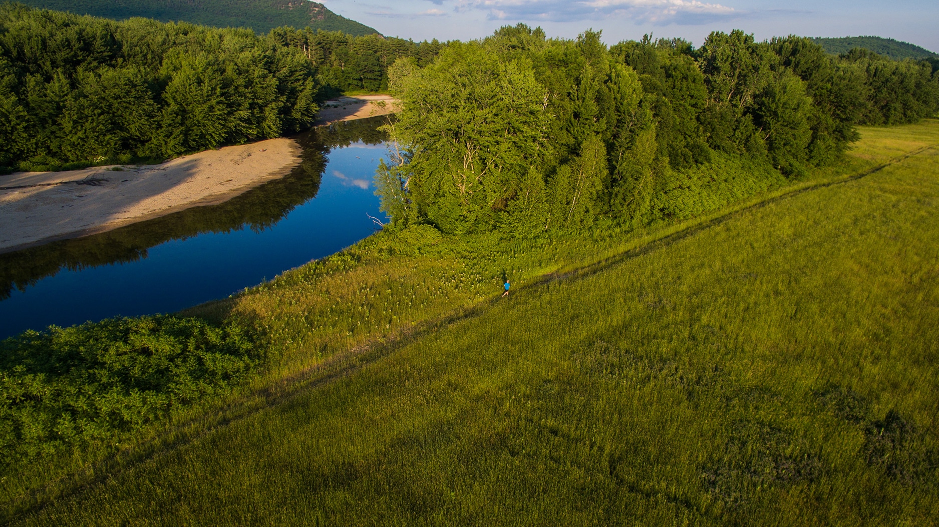 Dominick Laporte running along the Saco River in North Conway, NH