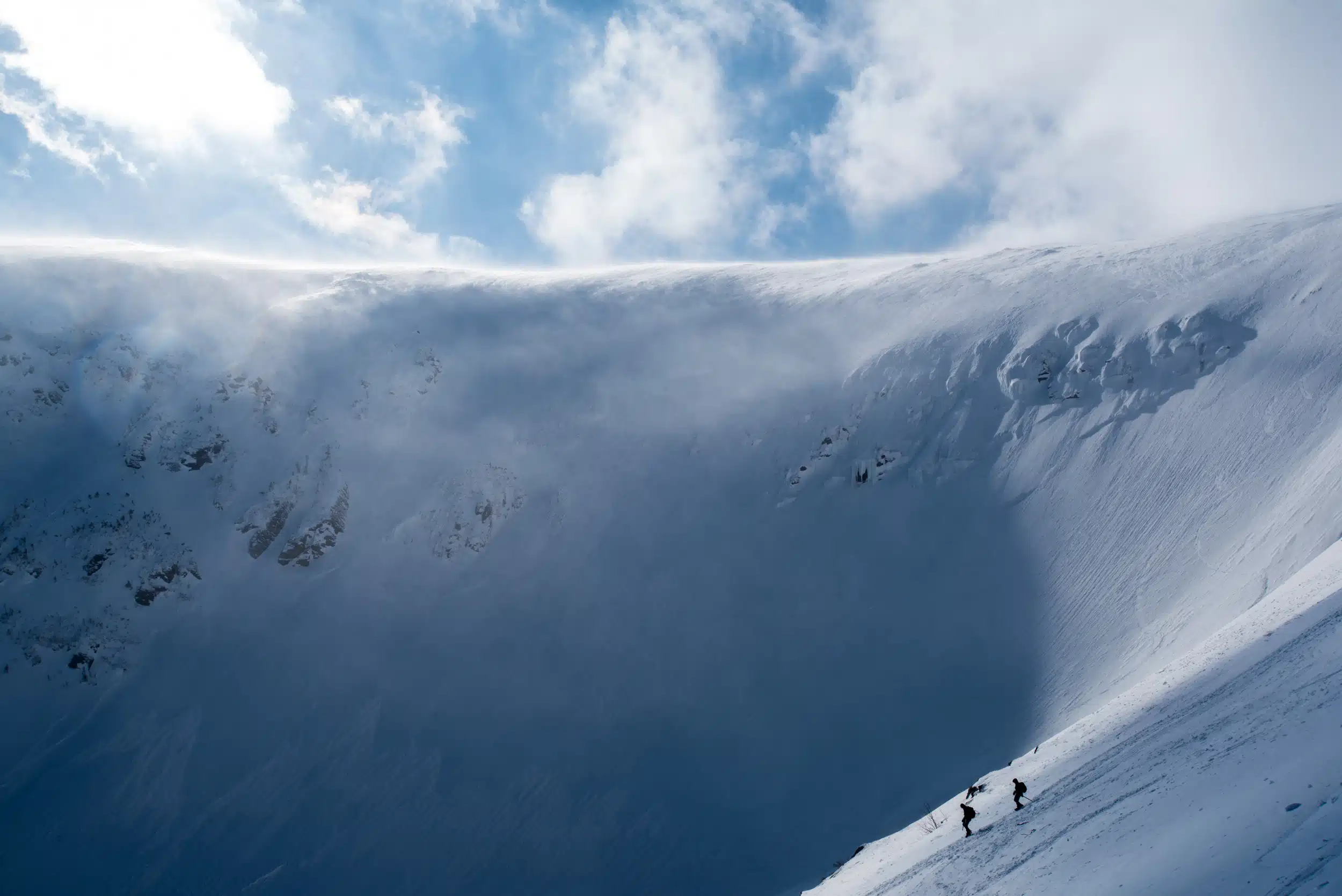 "Heading Home". Two hikers descending into Tuckerman Ravine on a sunny February afternoon.