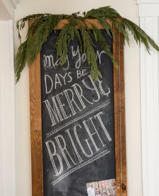 A chalkboard frame created from old bed slats helps spread holiday cheer and display greeting cards.