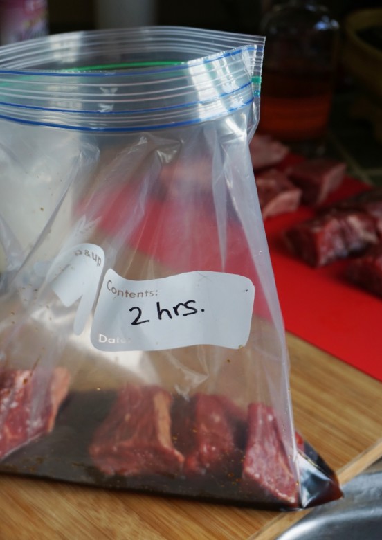 Add the meat and onion to the steak tip marinade in a zip-top bag. 