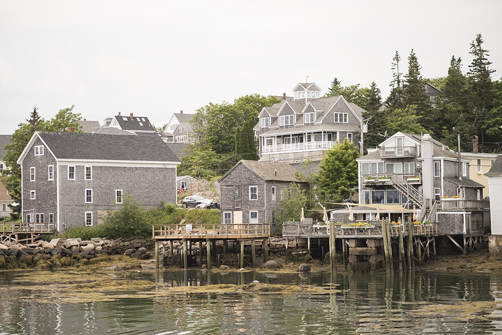 Shingled homes and businesses sit along the harbor in Stonington.