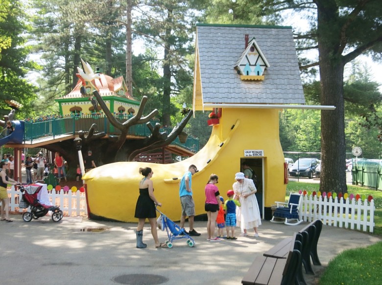 The "old woman" of There Was an Old Woman Who Lived in a Shoe hands out Story Land stickers to all show visitors.